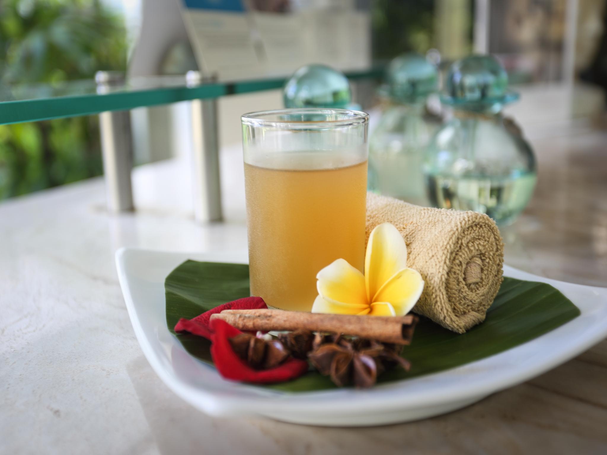 Furamaxclusive Ocean Beach Seminyak Bali Legian Eksteriør billede A glass of jamu