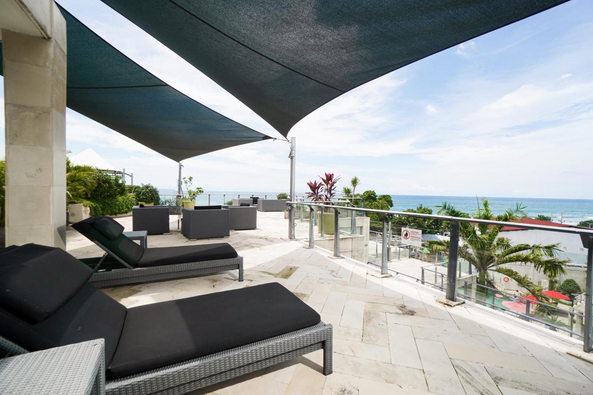 Furamaxclusive Ocean Beach Seminyak Bali Legian Eksteriør billede A shade sail over a balcony